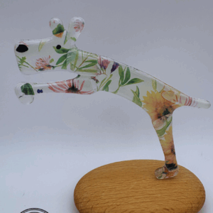 Jumping dog on a pebble in Cream Flowers glass