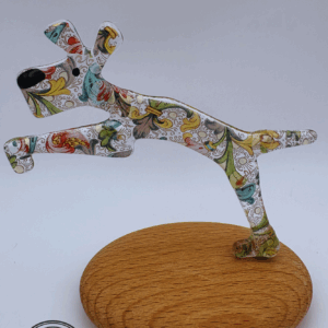 Jumping dog on a pebble in Paisley glass
